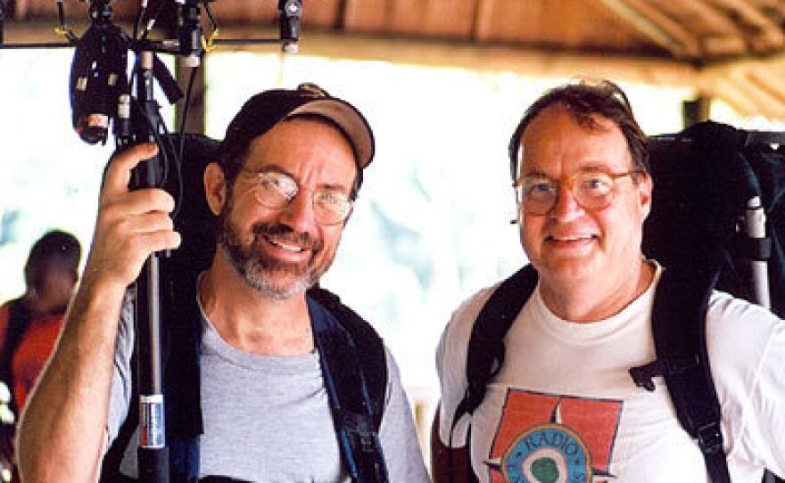 Bill McQuay and former NPR host and correspondent Alex Chadwick in 2002, after an elephant recording session at Dzanga Bai, in the Central African Republic.