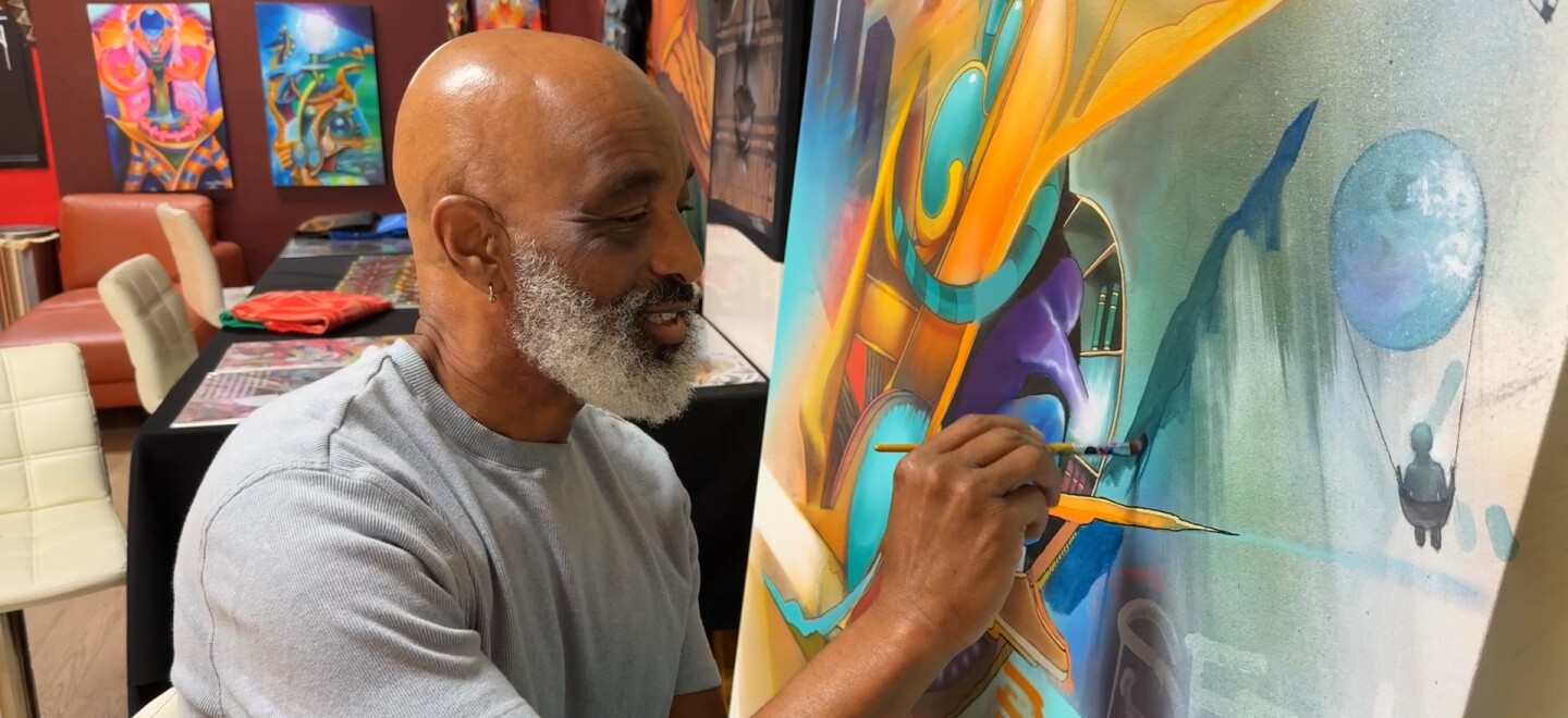Artist Maxx Moses painting in his studio at Graffiti Gardens in Encanto. Nov. 17, 2025