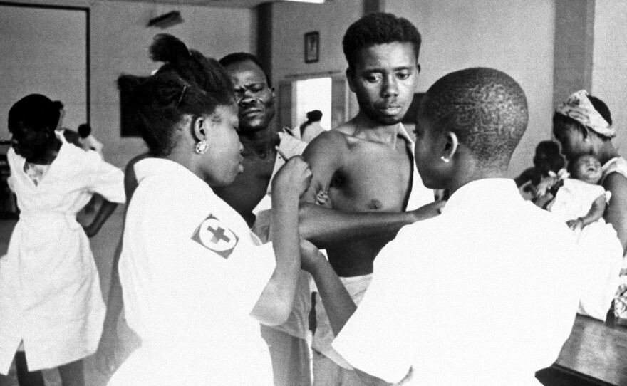 Patients in a clinic line up to get a smallpox shot on Feb. 24, 1962, Leopoldville, Congo. Health workers used vaccination campaigns to finally eradicate smallpox by 1980.
