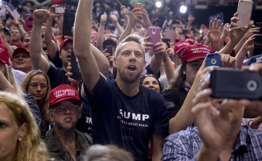 President Trump's supporters cheer as he speaks at a rally in Nashville, Tenn., in May. While Democrats are fired up for these midterms, so are his voters.