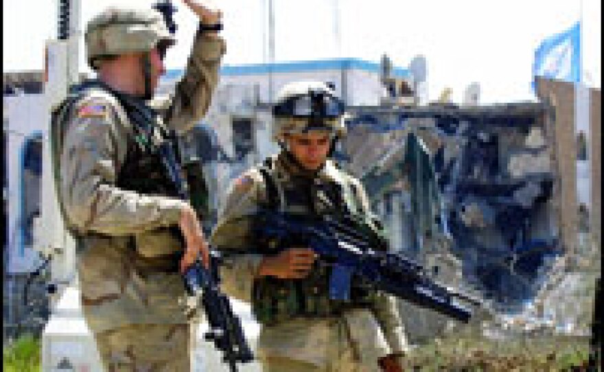 U.S. soldiers guard the Canal Hotel in Baghdad, where a massive truck bomb devastated the United Nations headquarters, in August 2003.