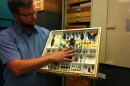Dr. Michael Wall showing one of the trays of specimens from the San Diego Natural History Museum's collection.