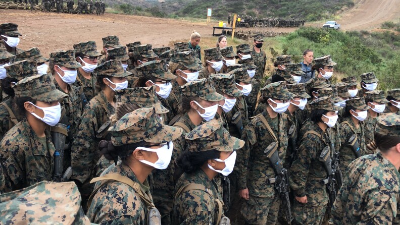 First female recruits wait on top of the Reaper, the highest point in Camp Pendleton, to receive their Eagle Globe and Anchor, the symbol that they are now Marines, April 22, 2021. 