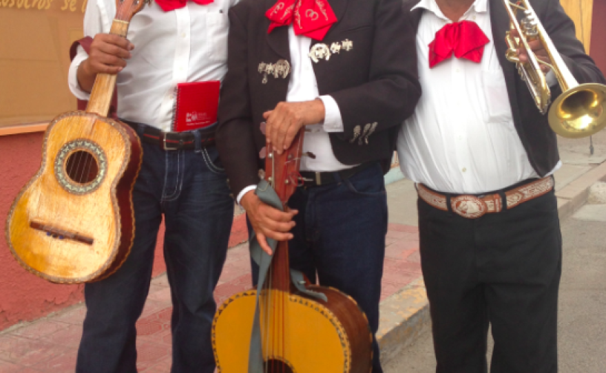 Three members of Mariachi Frontera pose after rehearsing in front of a neighbor's home in Ojinaga, Chihuahua. Raymondo Sevilla (left) applauds the U.S. stand on ivory despite any inconvenience it might cause.