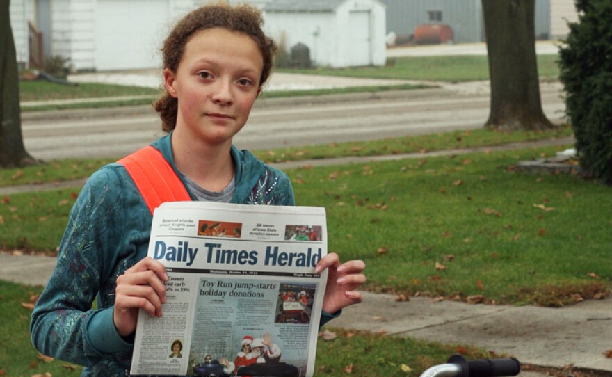 Meridith Beeber on her paper route in Templeton, Iowa in 2012. Eighty percent of The Daily Times Herald's papers are delivered by young people.