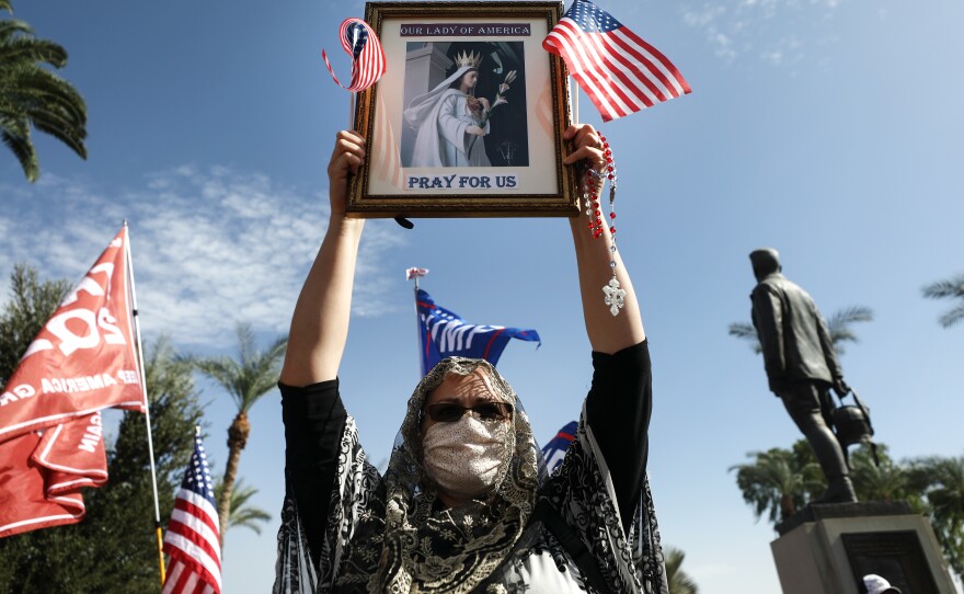 PHOENIX: A supporter of President Donald Trump demonstrates at a 'Stop the Steal' rally in front of the State Capitol on November 7, 2020 in Phoenix, Arizona.
