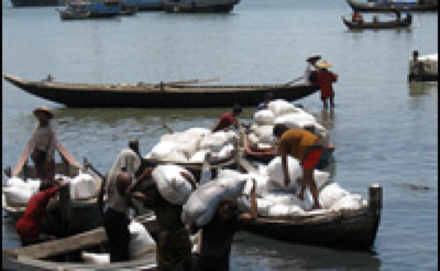 Muslims unload rice at the port of Sittwe, in Myanmar's northern Rakhine state. Nearly 1 million ethnic Rohingya Muslims live in the state, though many are fleeing repression by Myanmar's regime.