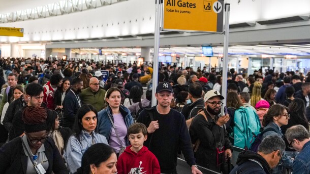 People wait in long TSA security lines at John F. Kennedy International Airport (JFK) in the Queens borough of New York, Monday, March 23, 2026.
