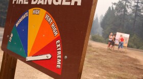 A sign displays current fire danger as extreme in Southern California. 