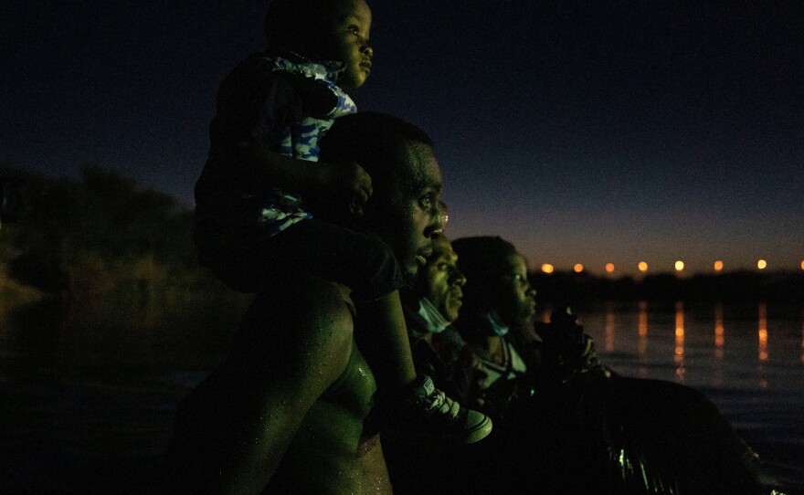 Haitian migrants cross the Río Grande into the U.S. from Ciudad Acuña, México on Sept. 22, 2021.