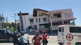In this photo provided by the Philippine Red Cross, rescuers inspect the damage after an earthquake in General Santos, Philippines, Monday, June 8, 2026.