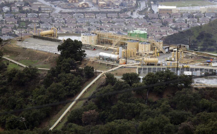 This Jan. 12, 2017, file photo, shows a gas gathering plant on a hilltop at the Southern California Gas Company's Aliso Canyon storage facility near the Porter Ranch neighborhood of Los Angeles.