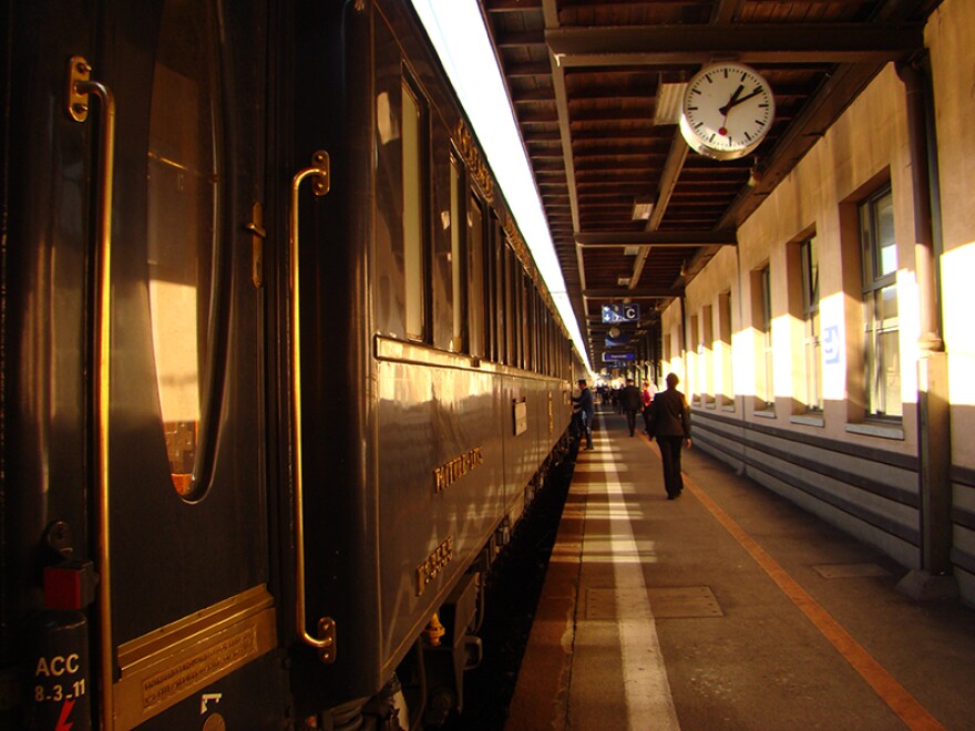 The Venice Simplon-Orient-Express at train station. In "The World’s Most Famous Train," hear the stories of the newly engaged couples, honeymooners, train enthusiasts, and staff members taking a 36-hour ride into the golden age of travel aboard the Venice Simplon-Orient-Express.