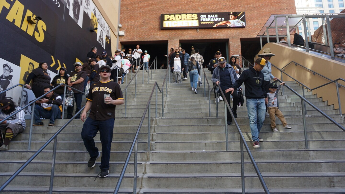 Guests walk along the steps at Petco Park during the San Diego Padres Fanfest.