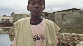 Denick, age 14, in his neighborhood, Haiti. “Children of Haiti” follows three teenage boys who reflect on their country and their lives, while sharing a common dream of education, government assistance, and social acceptance.