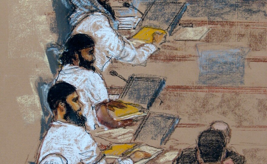 In this photo of a sketch by court artist Janet Hamlin, (top to bottom) Khalid Sheik Mohammed, Walid bin Attash, Ramzi bin al-Shibh, Ammar al-Baluchi, and Mustafa al-Hawsawi attend a hearing at the U.S. Military Commissions court for war crimes at the U.S. Naval Base in Guantanamo Bay, Cuba, in Jan. 2009.