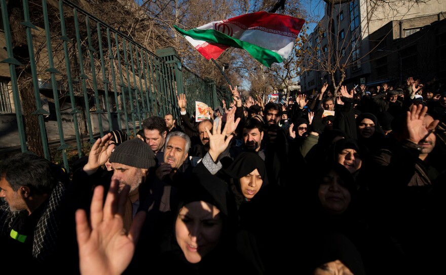 People crowd the streets in Tehran on Monday to pay respects to Maj. Gen. Qassem Soleimani, the commander of Iran's elite Quds Force who was killed last week in a U.S. drone strike in Baghdad.