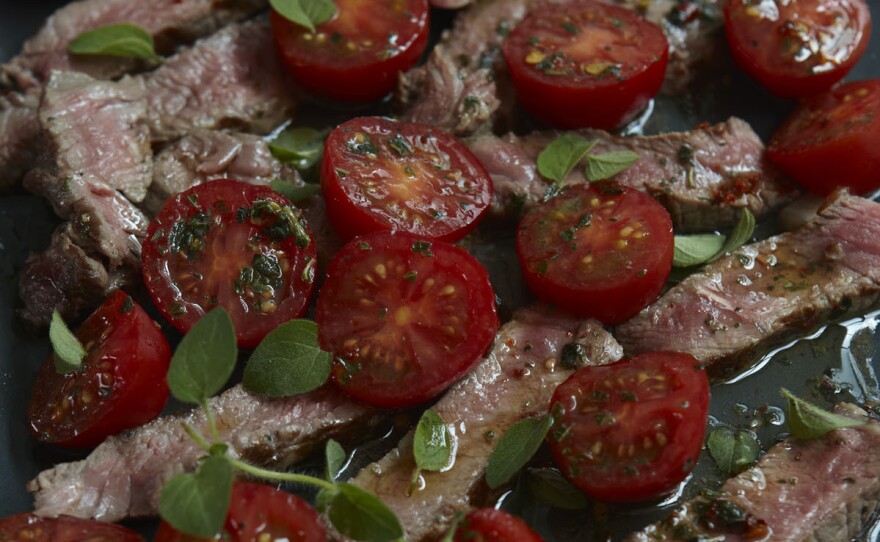 Instead of going to the butcher and asking for a huge hunk of steak cut specially, you can make one supermarket strip steak (it still should be good meat, or don't bother) stretch to feed two of you with no suggestion of scrimping.