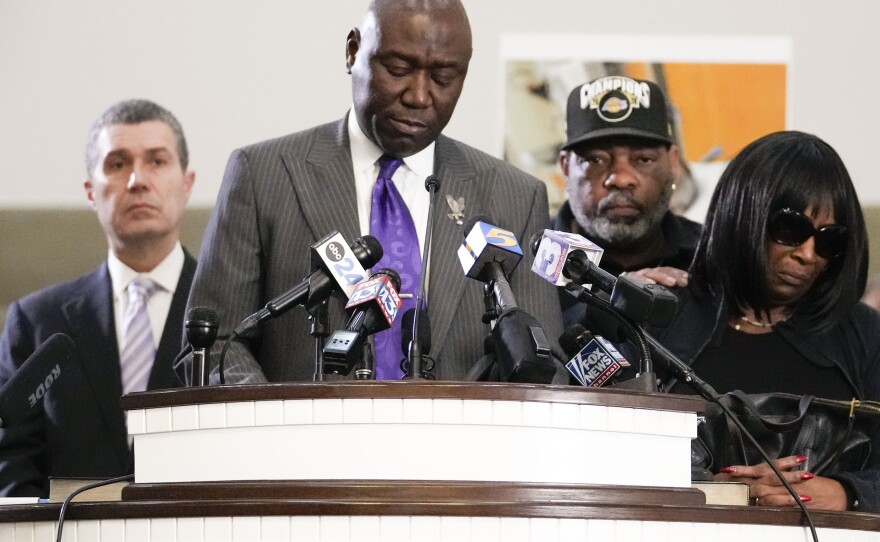 Civil rights attorney Ben Crump speaks at a news conference with the family of Tyre Nichols, who died after being beaten by Memphis police officers, as RowVaughn Wells, mother of Tyre, right, and Tyre's stepfather Rodney Wells, along with attorney Tony Romanucci, left, also stand with Crump, in Memphis, Tenn., Monday, Jan. 23, 2023.