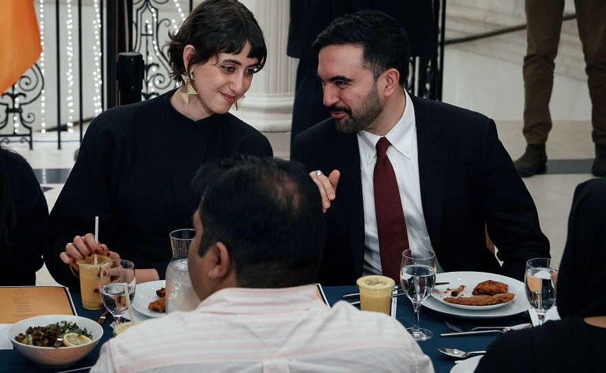 New York City Mayor Zohran Mamdani, right, speaks with his wife, Rama Duwaji, left, during a Ramadan iftar meal at the Museum of the City of New York on Thursday, March 12, 2026, in New York.