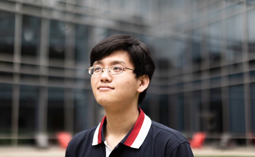 An Nguyen sits for a portrait at George Mason University in Fairfax, Va. Nguyen had just turned four when his father died in the 9/11 attack on the Pentagon.