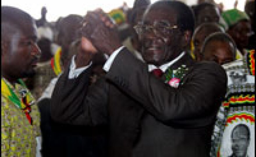 Zimbabwean President Robert Mugabe greets congregation members before addressing a church service in Bulawayo on Sunday.