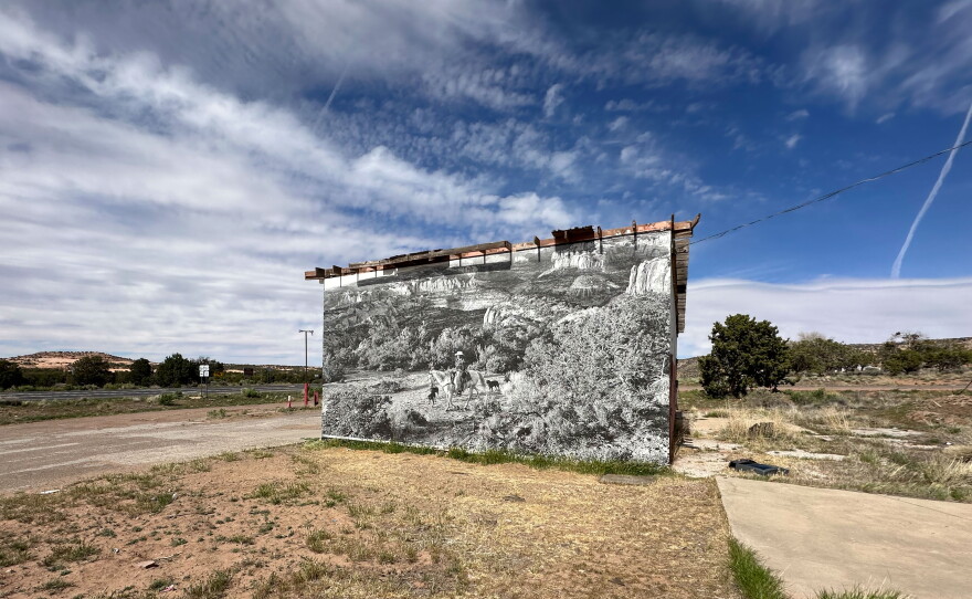 Thomas places his work on buildings near highways that traverse the Navajo Nation. This 2025 work is visible from US Highway 160, at the abandoned Black Mesa Shopping Center, west of Kayenta, Az.