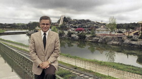 FILE - Television evangelist Jim Bakker poses in front of the Water Park in Columbia, SC, one of the attractions at his Heritage USA, March 19, 1987.