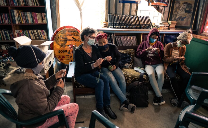 Kids learn to knit at the Hot-Spot library, which offers regular classes for the community.