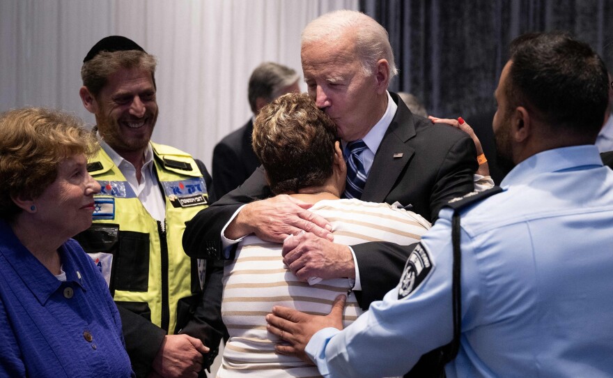 President Biden hugs Rachel Edri, who was held hostage by Hamas, during his trip to Tel Aviv. Biden met with people who had witnessed the horrors of the Oct. 7 Hamas attack on Israel.