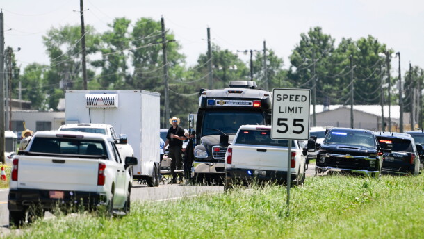 Emergency vehicles are parked outside the Butler Memorial Airport after a plane crash in Butler, Mo., on Sunday.