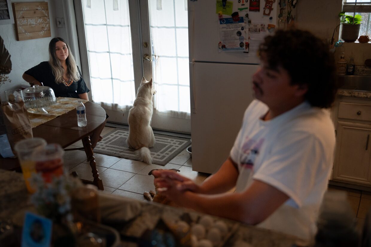 Barajas and her boyfriend Nicanor Verdugo speak together in their family kitchen recalling buying their new car on Aug. 22, 2024. 