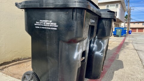 Trash bins stand in an alley in Ocean Beach, Sept. 17, 2025.