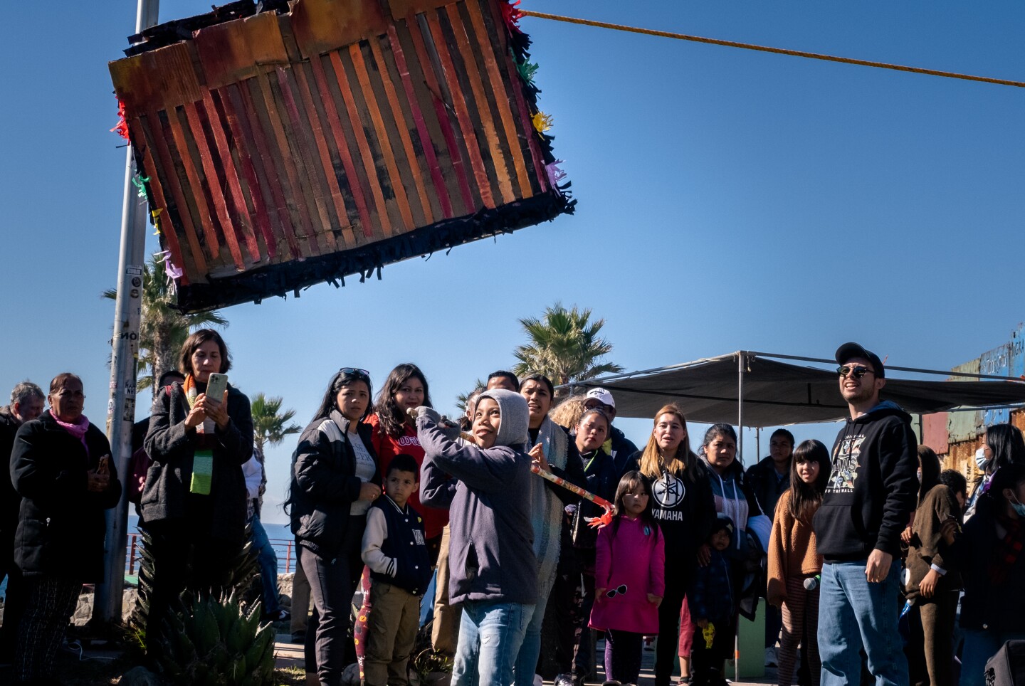 Migrant activists celebrate Christmas in binational Friendship Park as possible closure looms.