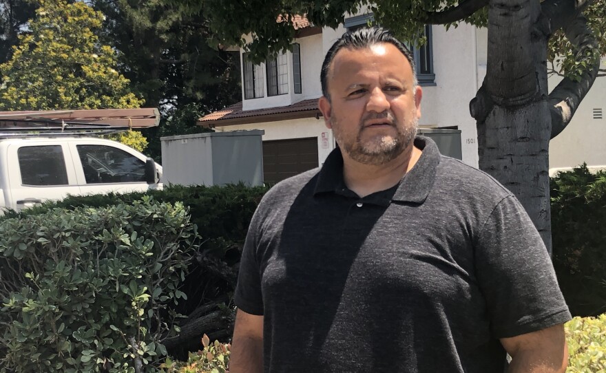 Gabriel Guzman stands outside his Chula Vista home, June 14, 2021.