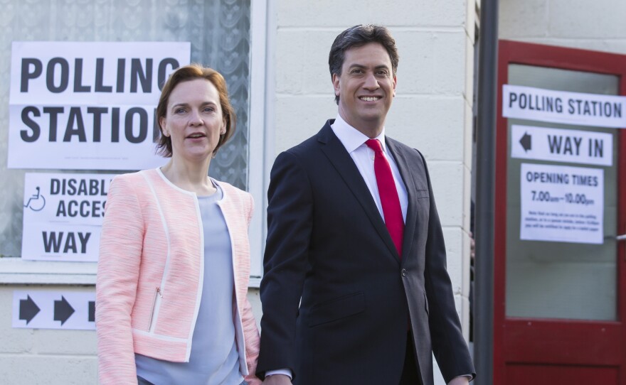 Labour Party leader Ed Miliband and his wife Justine leave the polling station after voting at Sutton Village Hall, Doncaster, England on Thursday.