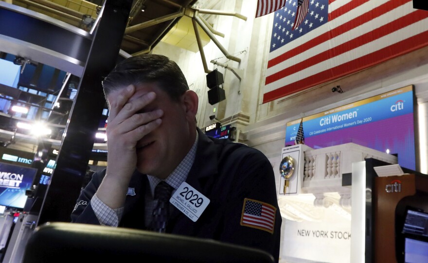 A trader reacts on the floor of the New York Stock Exchange on Monday. The U.S. stock market had its worst day since 2008.
