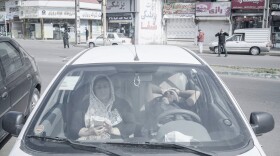 Patients wait in their car instead of waiting in the hospital in Guilan, Iran.