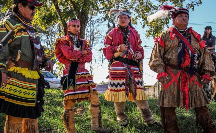 Traveling from the Big Cypress Reservation in South Florida, the Seminole Riders get ready to lead the Homecoming Parade. Left to right: Moses Jumper, Cory Sawgrass, Kenny Descheene, Jr., and Kenny Descheene, Sr. This was the first time the tribe sent mounted riders to Tallahassee to take part in the Homecoming festivities around Osceola.