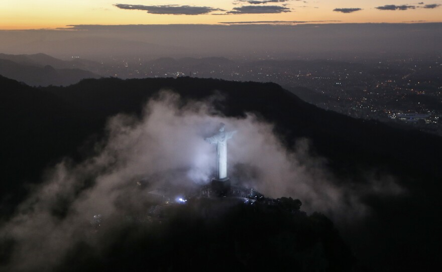 The Christ the Redeemer statue stands in the mist above Summer Olympics host city Rio de Janeiro last month.