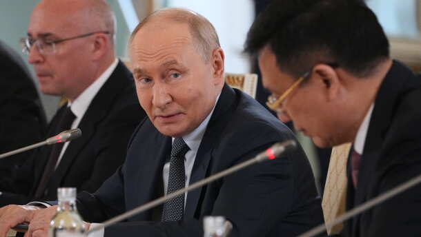 Russian President Vladimir Putin, center, looks at President of Xinhua News Agency Fu Hua, right, while speaking to representatives of international news agencies as General Director of the Russian news agency TASS, Andrey Kondrashov, left, sits near on the sidelines of the St. Petersburg International Economic Forum at the Constantine Palace in St. Petersburg, Russia, on Thursday, June 4, 2026.