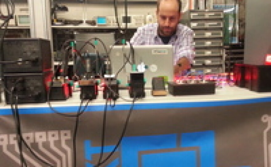 A member works in the electronics lab at NextFab Studios in Philadelphia. Members pay for access to computers and high-end machines like laser cutters and 3-D printers.