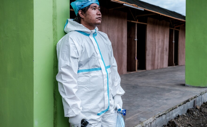 Alejandro Evangelista Ramilloza II, 29, a nurse on duty at the quarantine facility in Bambang, Nueva Vizcaya, Philippines. He was surprised by the discrimination he faced because of his job. He heard people say "You work in isolation? You must have COVID." That "stings a lot because instead of encouragement, it's disappointing to hear from people I know," he says.