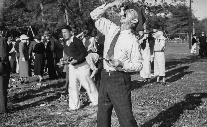 In 1939, the Federal Writer's Project launched an ambitious program to document the country's food traditions at a time of great culinary change – as fast-food was rising, local traditions were waning and "ethnic" cuisine was becoming American cuisine. Above, a man eats oysters from the shell at a political rally in Jackson, Miss., in 1940. The image was shot as part of the America Eats project.