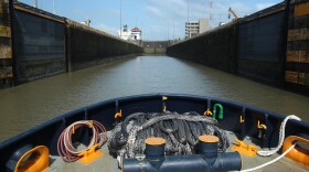 A tugboat advances toward the Miraflores Locks near the Panama Canal’s Pacific entrance. 