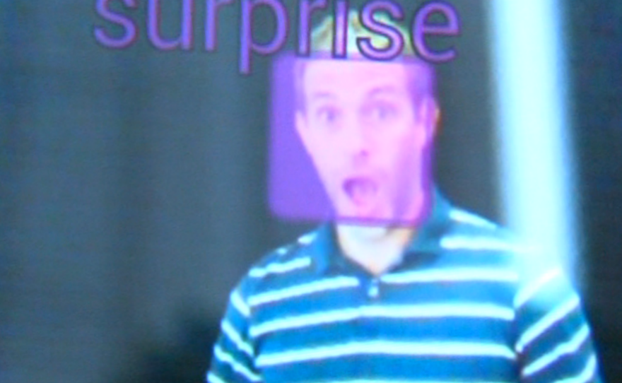 A purple box signifying a surprised expression is superimposed on the image of Emotient researcher Josh Susskind's face.