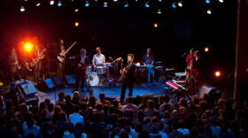 (left to right) Stuart Bogie, Justin Walter, Elliot Bergman, Matt Lux, Jim Becker, Joe Adamik, Sam Beam, Ben Massarella, Nick Luca, Aida Shahghasemi, Markéta Irglová. Sam Beam, better known as Iron & Wine, leads a 12-piece band through an array of his songs from Iron & Wine’s most recent album, "Kiss Each Other Clean," and other favorites, at a taping at Atlanta's historic Buckhead Theatre on November 10, 2011.
