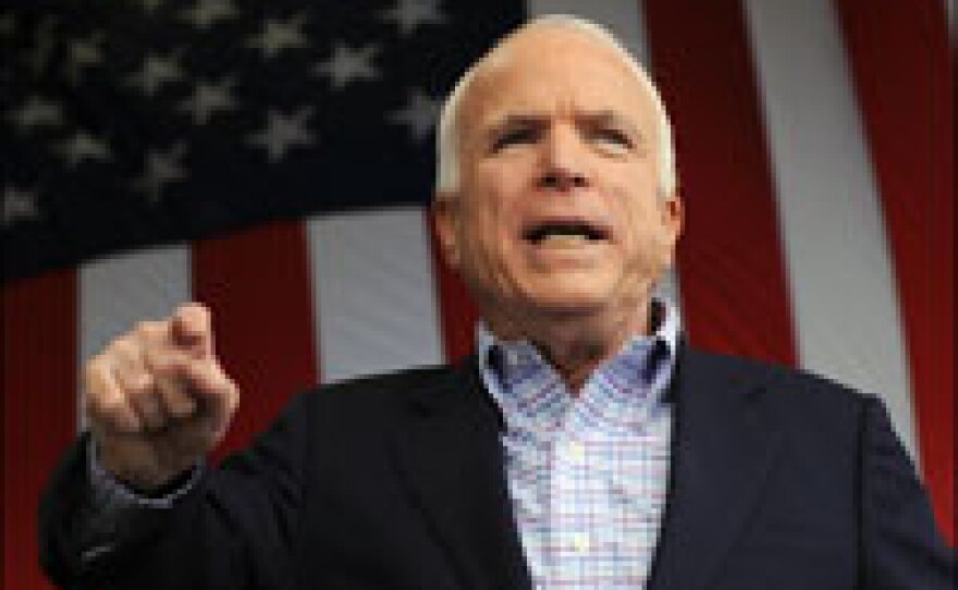 Republican presidential nominee John McCain addresses a rally on in Woodbridge, Va., Oct. 18, 2008. McCain warns that Obama's accumulation of such massive amounts of money can lead to fundraising abuses.