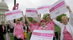 Breast cancer survivors from the Pink Ladies of Charles County in Maryland dance at a Komen Community Challenge rally on Capitol Hill in Washington, D.C.