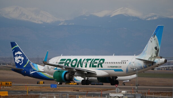 A Frontier Airlines jetliner waits for clearance to take off as high winds strafe Denver International Airport Thursday, March 12, 2026, in Denver.